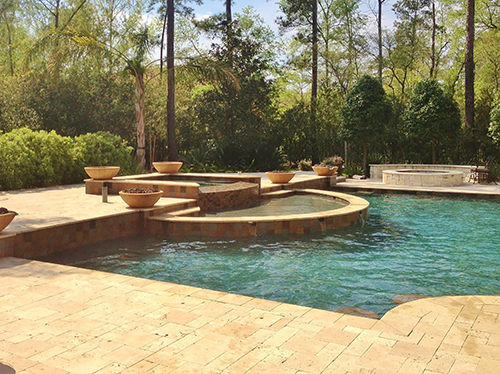 travertine-pool-decking-new-pool-installation-fire-bowls-planter-pavers-versailles-peble-tec-pool-landscape-design-designer-architect-the-woodlands-houston-spring-magnolia-conroe-montgomery-cypress.jpg