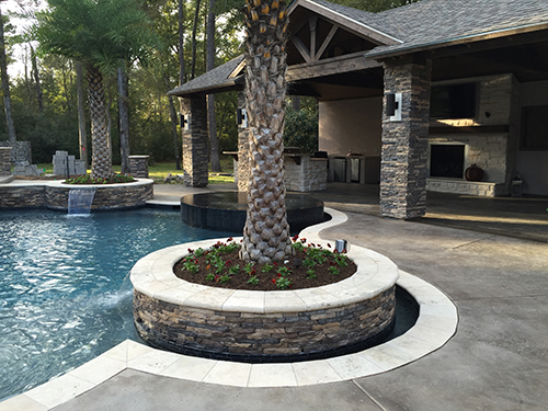 custom-outdoor-kitchen-pool-stone-hill-country-rustic-limestone-stamped-concrete-the-woodlands-woodlands,-tx-spring-houston-cedar-espresso-pool-planter-best-travertine.jpg