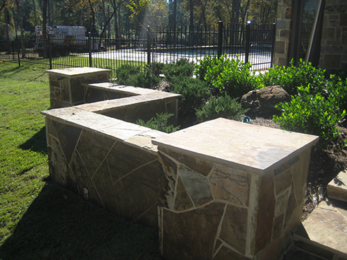 Custom-Stone-Installation-stone-seating-wall-flagstone-landscape-pool-the-woodlands-houston-tx-houston.jpg