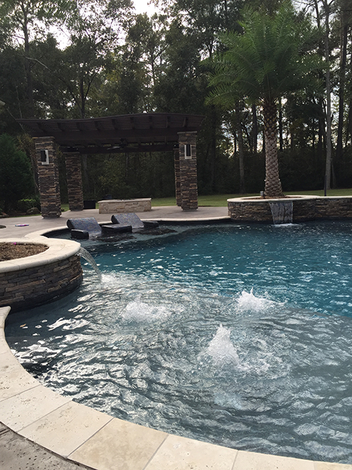 outdoor-arbor-pergola-stone-espressocedar-wood-stained-firepit-hill-country-the-woodlands-landscaper-landscape-company-houston-best-pool-lighting-palm-spring-conroe.jpg