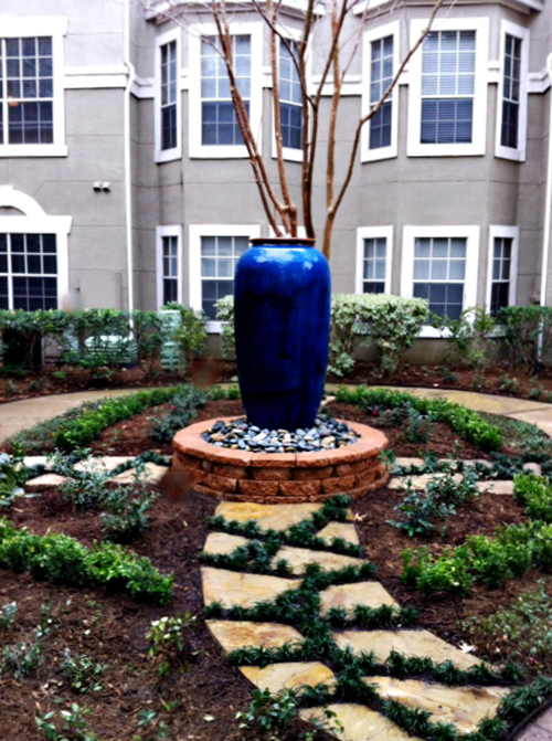 outdoor-fountain-courtyard-commercial-flagstone-modo-urn-pottery-water-feature-stone-custom-design-install-build-landscaper-landscaping-landscape-best-top-apartments-the-woodlands-houston-spring-magnolia-conroe-montgomery-cypress.jpg