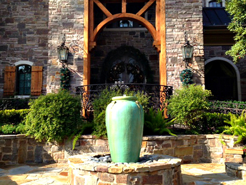 outdoor-seating-area-stone-brick-flagstone-water-fountain-feature-custom-design-installation-urn-pottery-with-fountain-carlton-woods-the-woodlands-spring-houston-luxury-builder-landscaper-cypress-conroe-montgomery.jpg