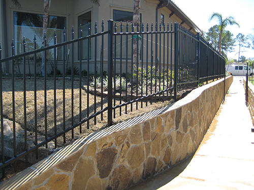 retaining-walls-lake-wrought-iron-fencing-landscape-landscaper-landscaping-ideas-aggie-top-luxury-custom-pool-builder-walkway-new-home-residential-commercial-the-woodlands-houston-spring-magnolia-conroe-montgomery-cypress.jpg