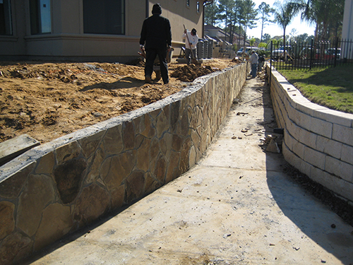 stone-flagstone-retaining-wall-lake-conroe-walls-walkway-to-lake-landscaper-landscaping-drainage-best-company-construction-new-builder-pool-the-woodlands-houston-spring-magnolia-conroe-montgomery-cypress.jpg