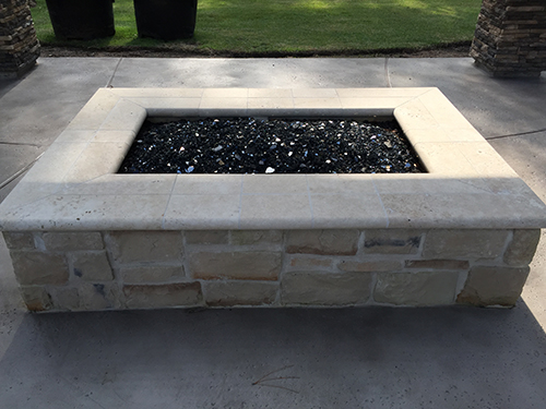 firepit--fire-pits-custom-limestone-glass-gas-best-landscaper-the-woodlands-design-and-build-general-construction-houston-luxury-pool-builder-and-landscape-spring-montgomery-aggie.jpg