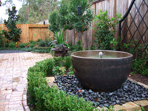 water-fountain-urn-pot-pots-planter-black-stone-pebbles-landscape-landsacper-best-install-installation-back-yard-outdoor-design-build-builder-pool-lawn-the-woodlands-envy-spring-cypress-montgomery-houston-conroe.jpg