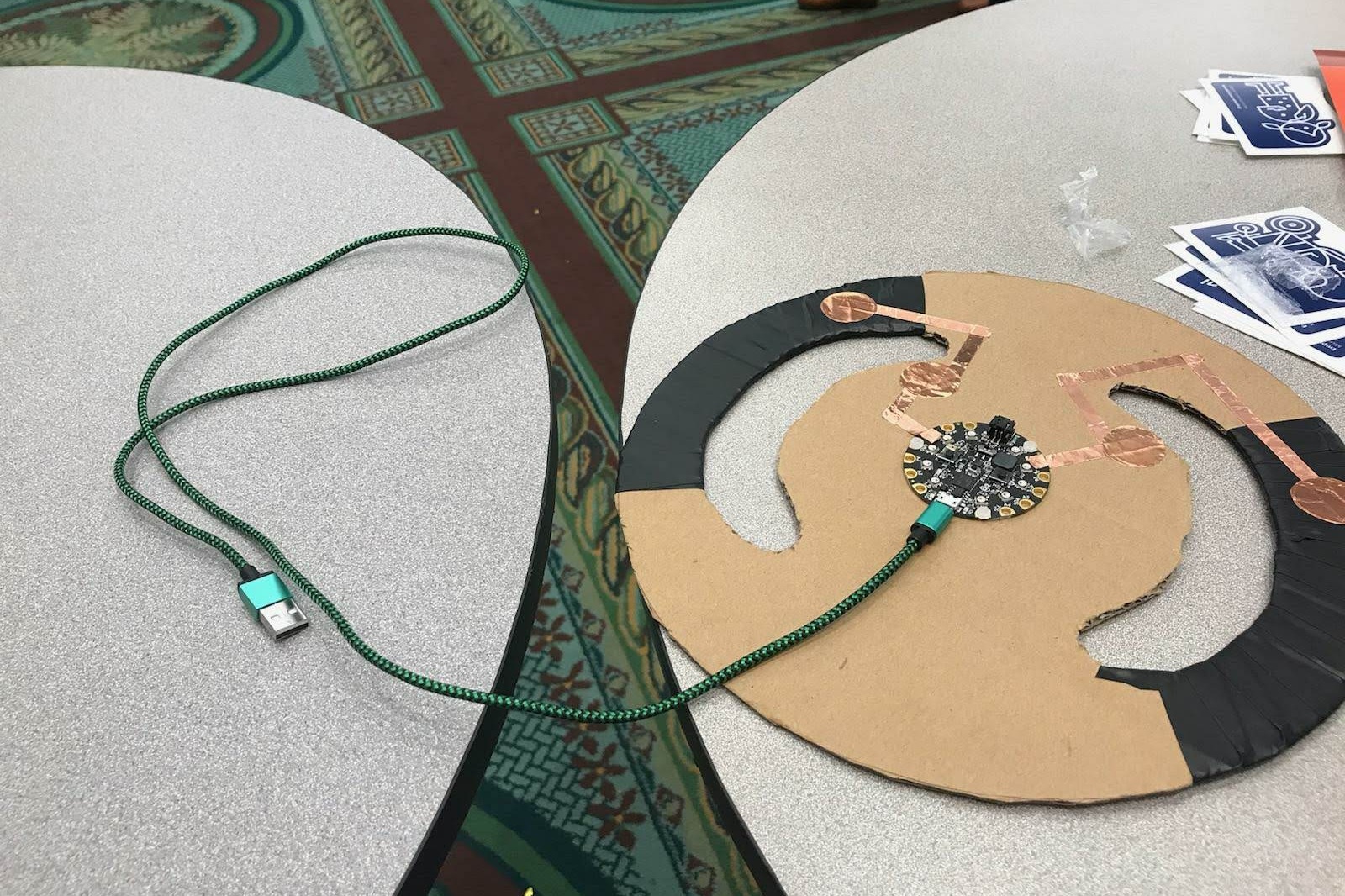 A modified steering wheel controller with the buttons in an easier to reach location.