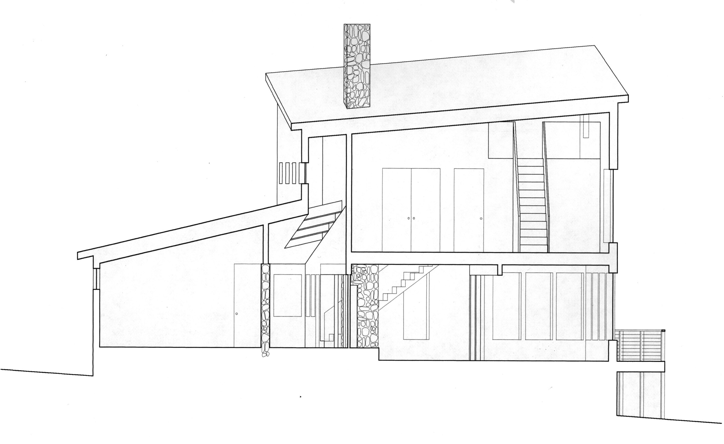 The clerestory-lit hall runs brings light into the center of the house and connects the interior to the ocean side porch in a continuous loop.