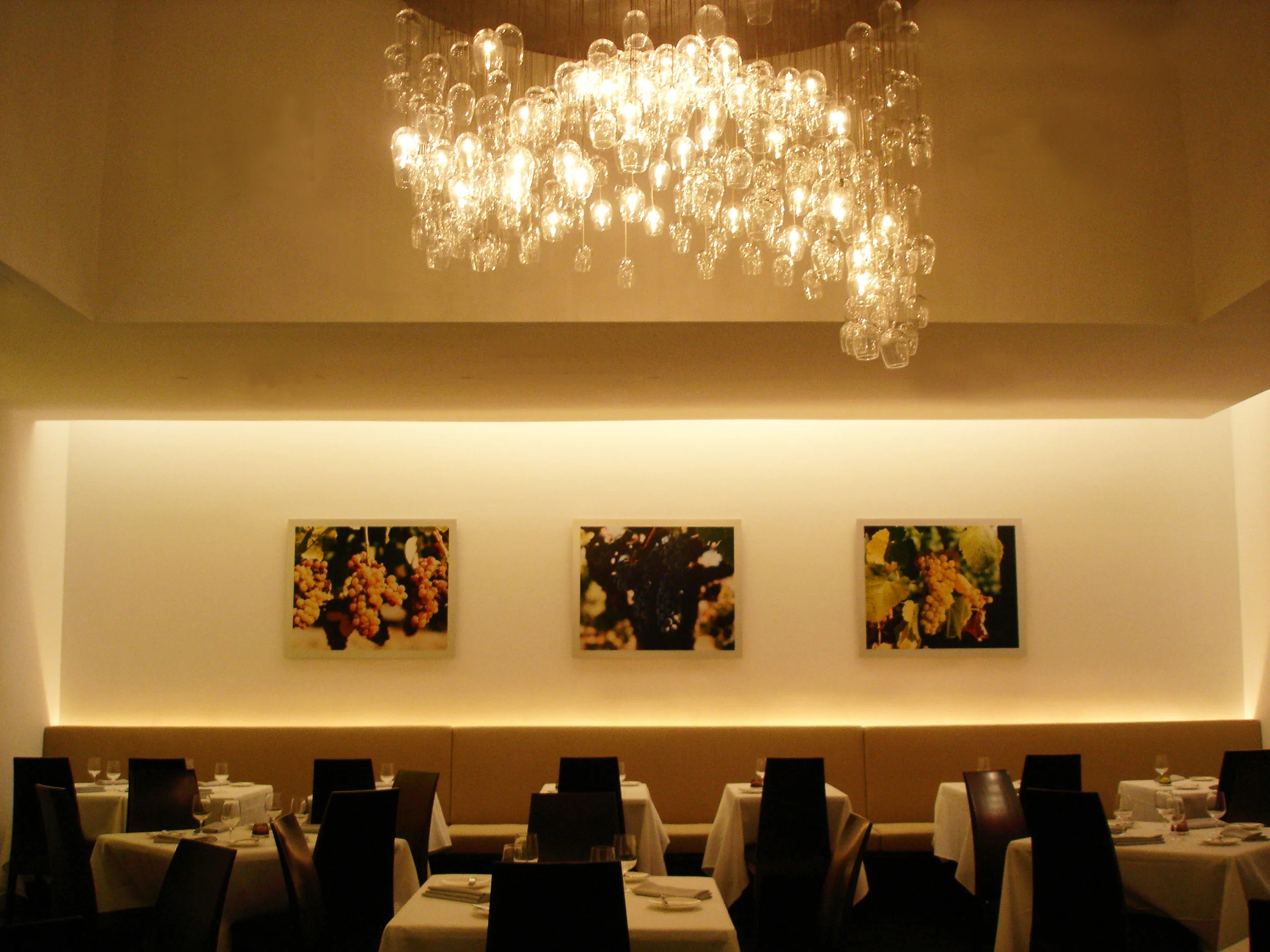 Varietal was a wine bar and restaurant in northern Chelsea with a formal dining room lined with banquets and a marble tasting bar. Each room had a chandelier designed and fabricated by Gans studio: a "flight" of champagne flutes above the bar, and a dome shaped cascade of goblets in the dining room.