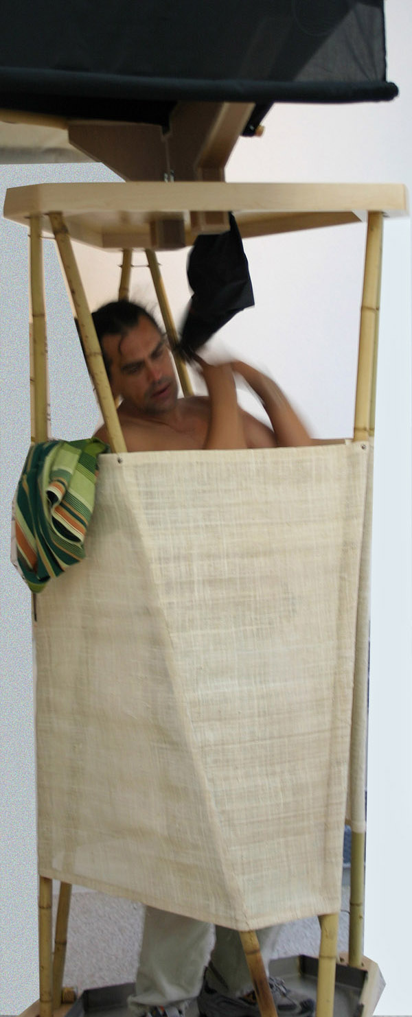 The bamboo column is a shower with water collected from the roof.