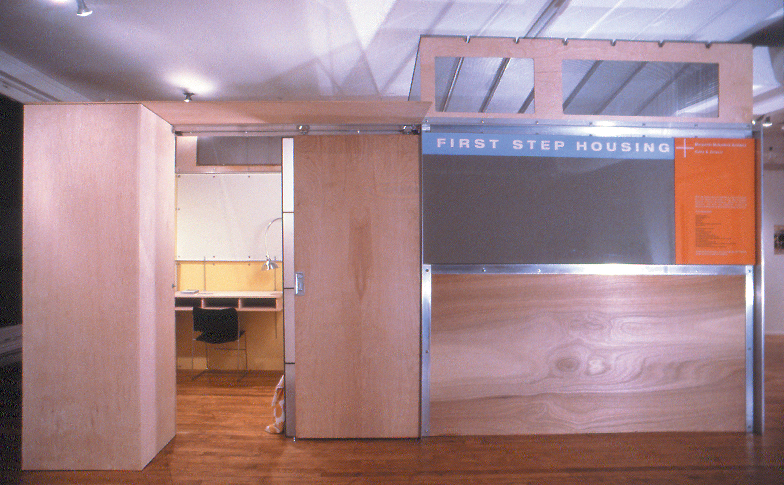 To control privacy there are three panels of perforated screen, translucent Kalwall and wood that slide and stack over the armoire and door openings in various ways. 