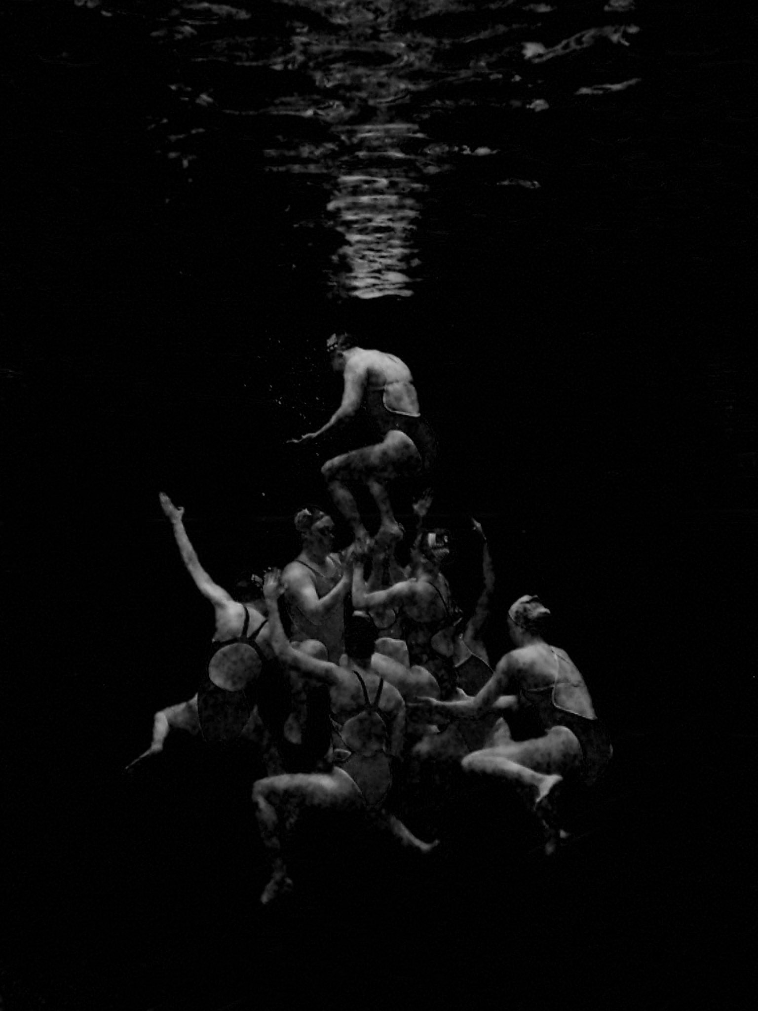 underwater art photograph synchronized swimming lift swimmers