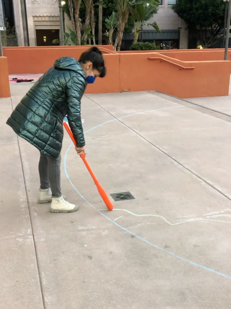 Drawing a chalk circle on the ground