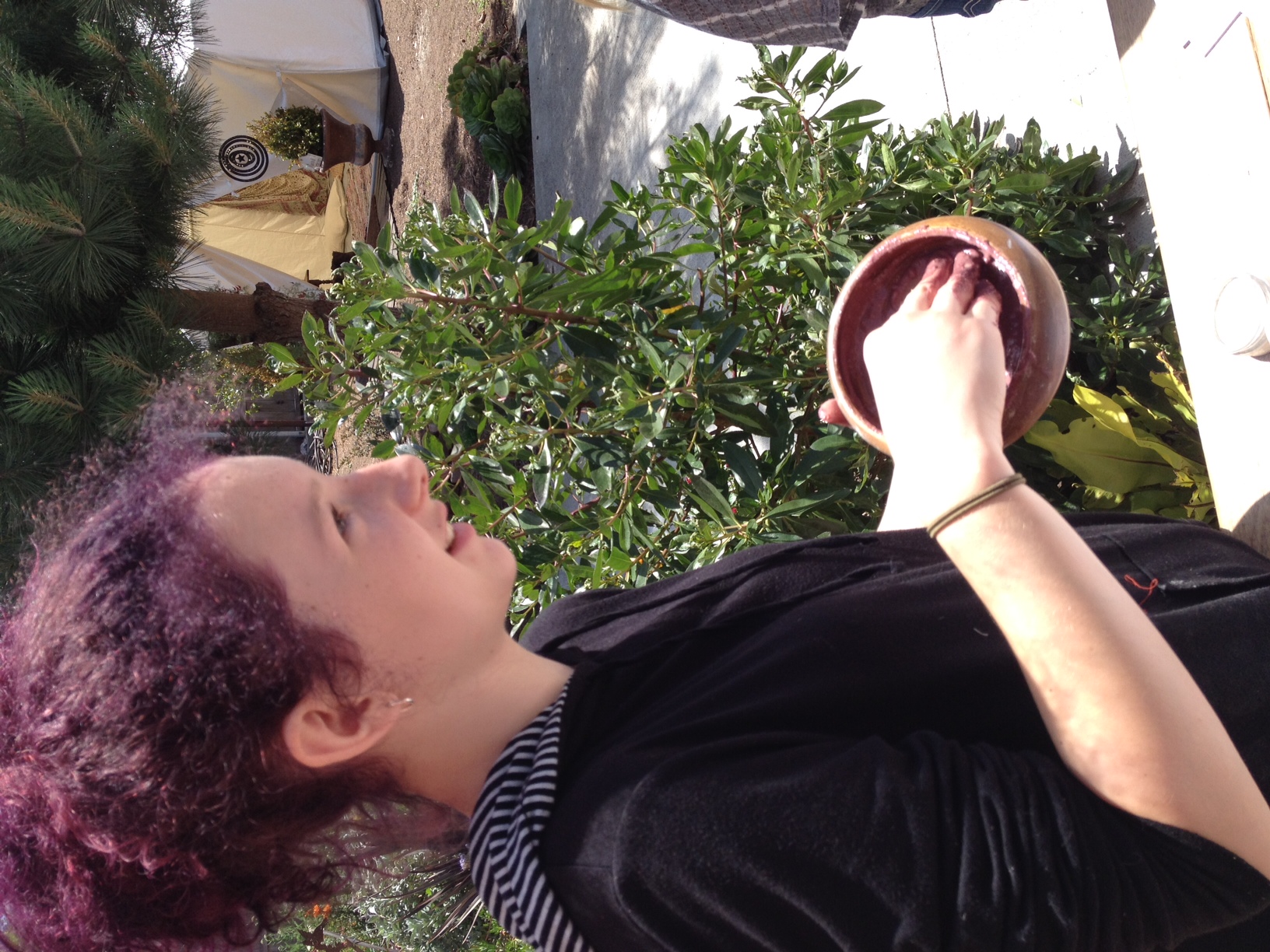 Julia making oats, clay, calendula, chamomile, and rose petals facial cleanser