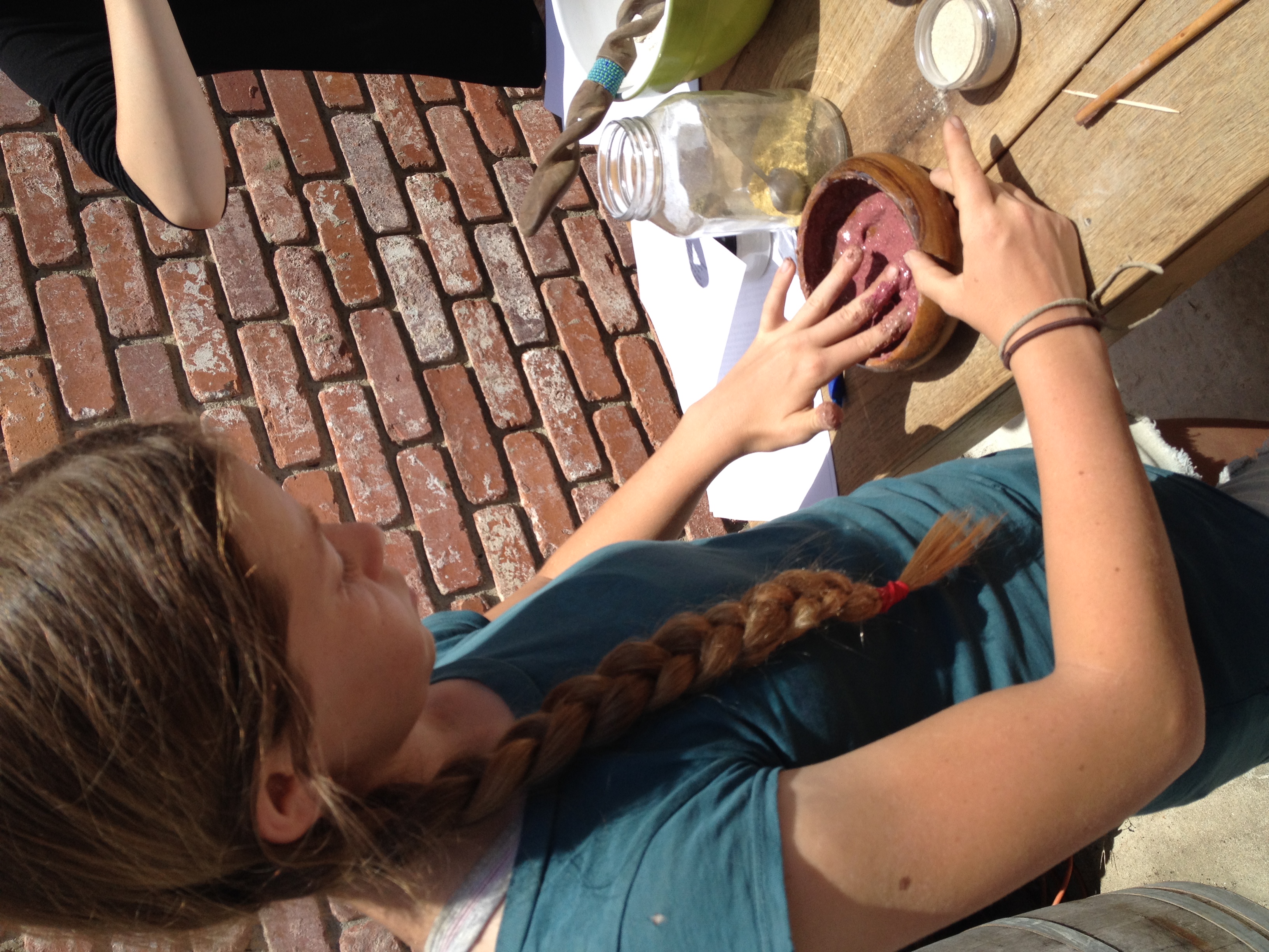 Alina mixing with her hands as she prepare her facial mask