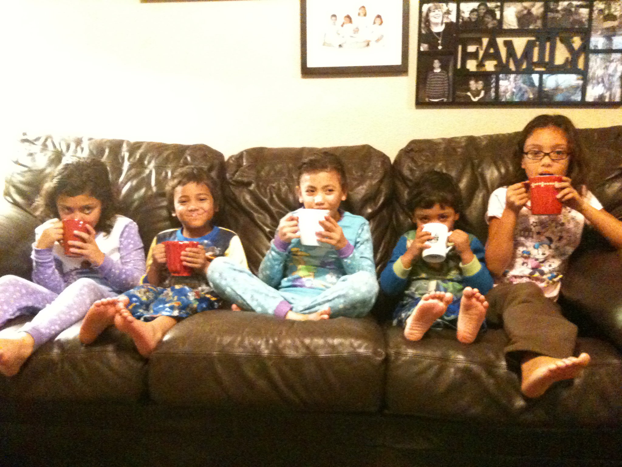 This was a few years ago, I haven't gotten a picture of them all sitting still together with their hot cocoa since! :) 
