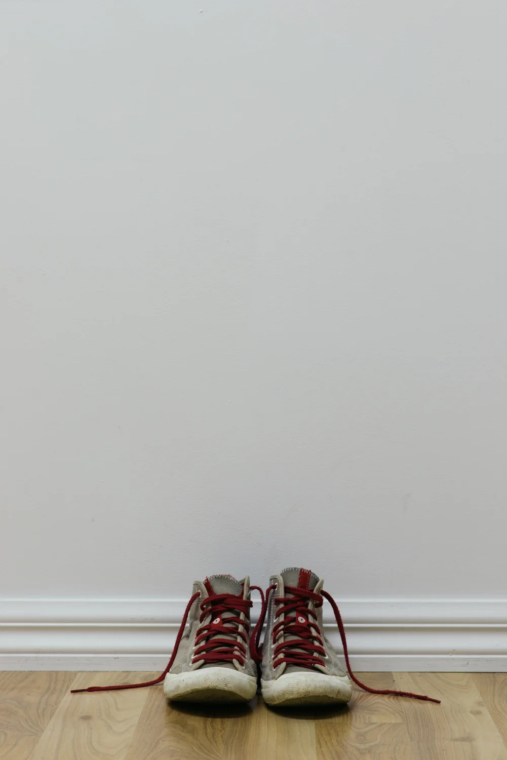 Justin Jade Morgan #WALKINMYSHOESHOMAGETOREGANGENTRYFOOTINTHEDOOR 2014/15 Pair of remo shoes with red laces as worn by the artist Size 9 Ongoing performance project; v isitors are in vited to try the shoes on and/or to wear them if possible while spending time in the gallery 