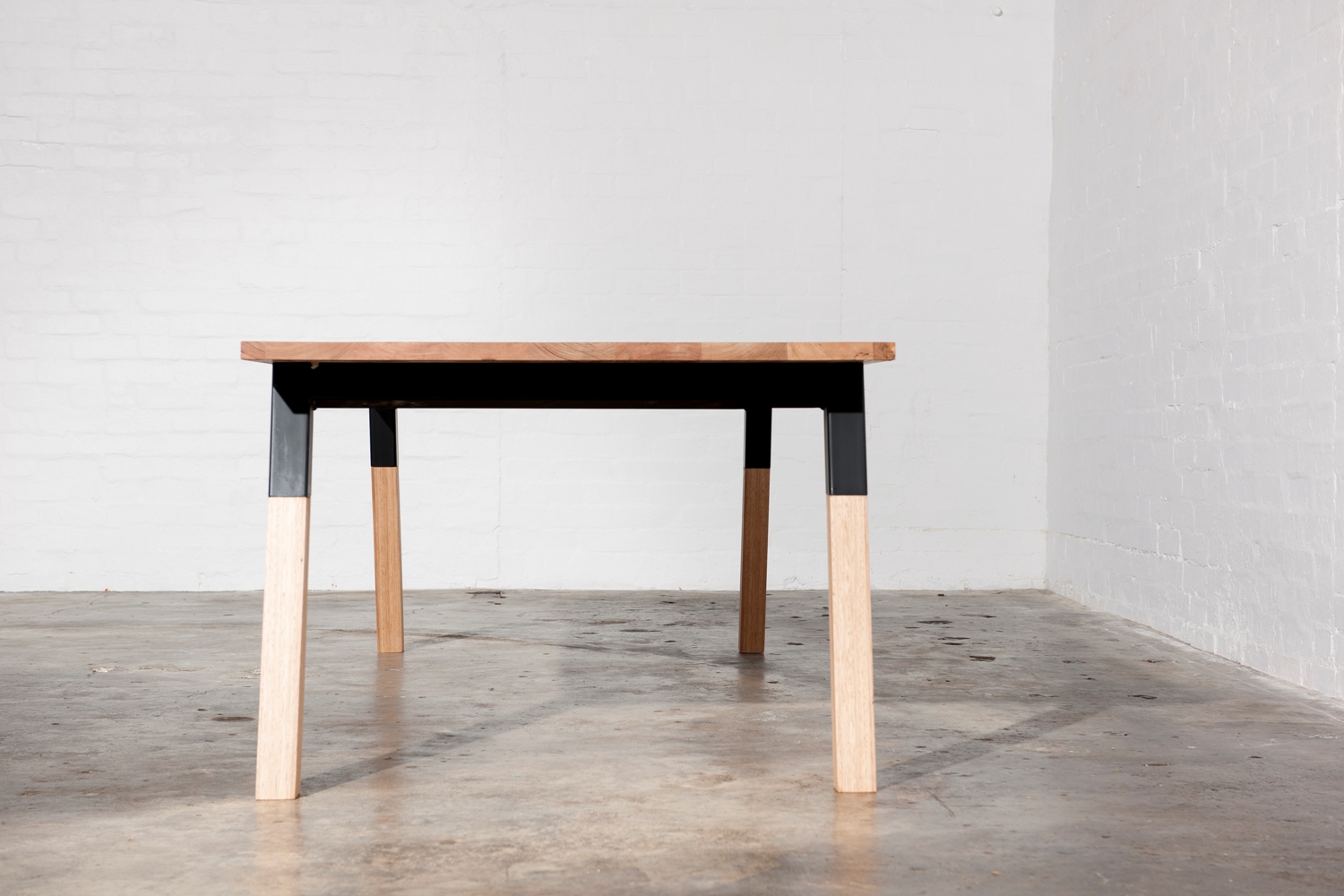 Modern black and timber dining table