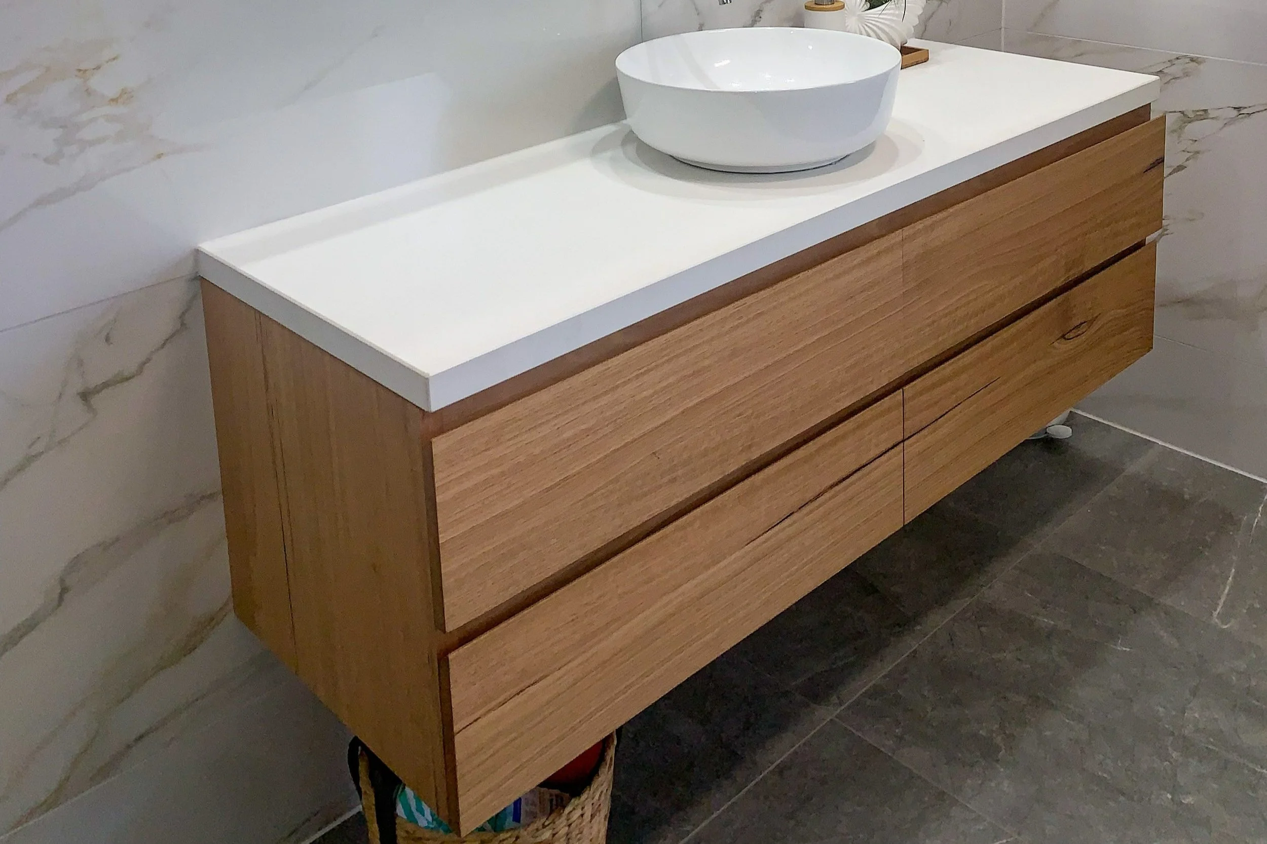 Floating solid recycled timber bathroom vanity with stone top