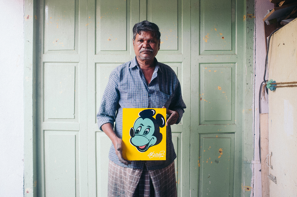 Mani, the auto painter of Madurai, with one of his Mickeys.