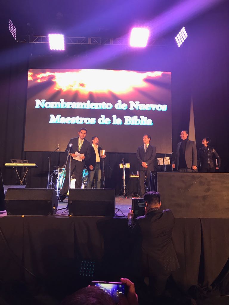 L-R: Arturo Elizarraras presents newly appointed congregational teachers, Jose Carlos Alaniz, Oscar & Carolina Figueroa