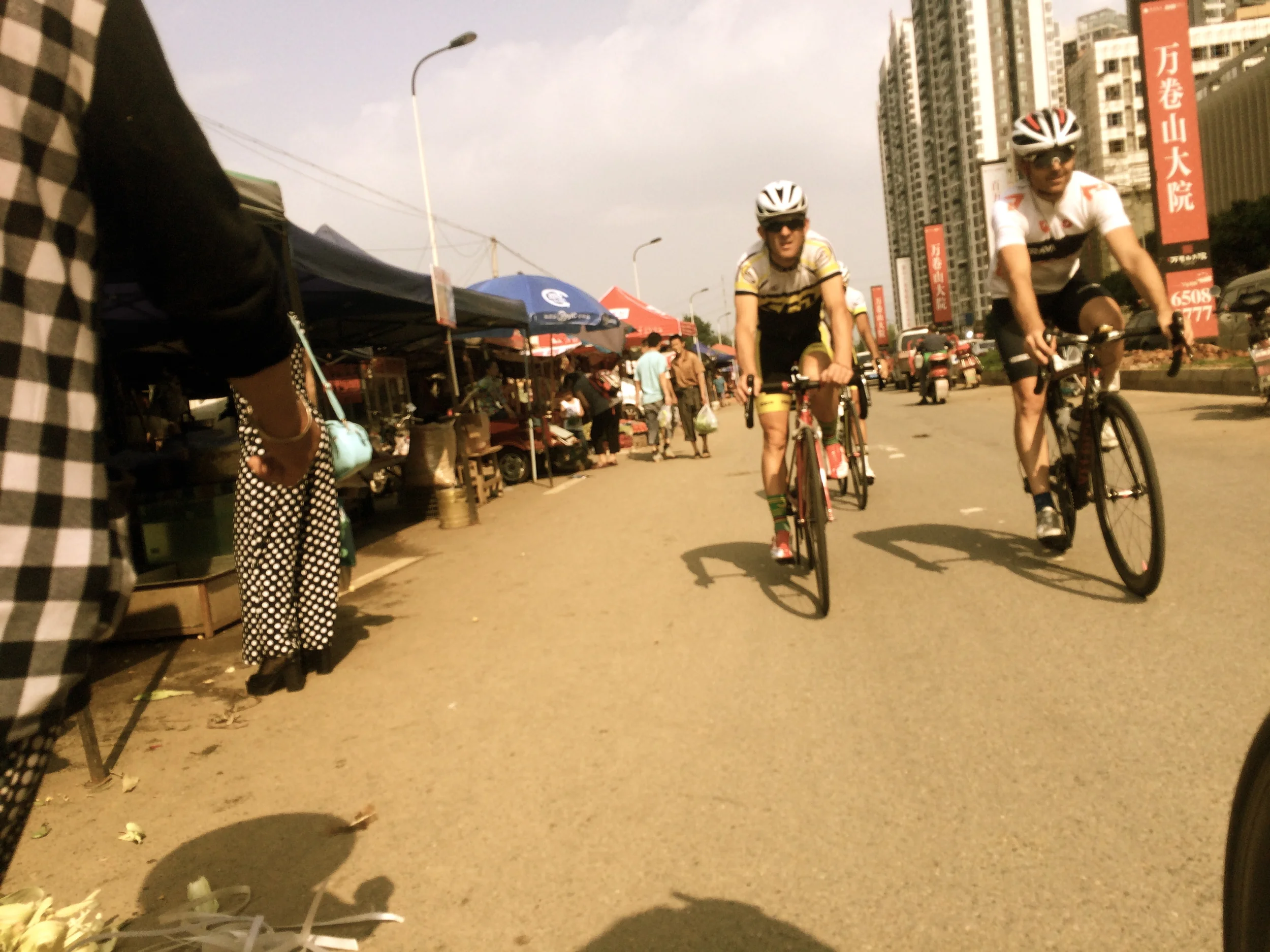 Riding along the market in Chengdu suburbs