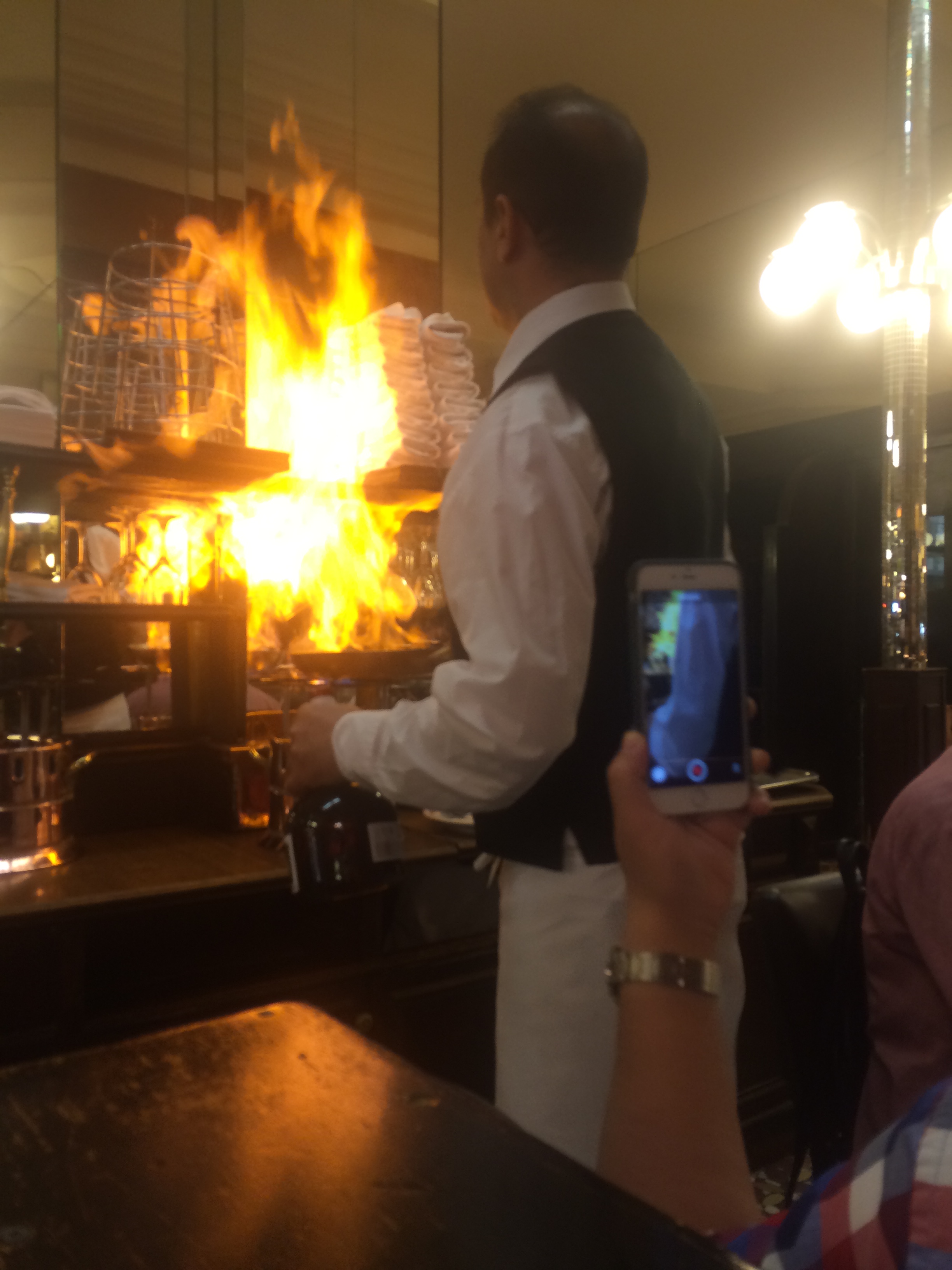Enjoying the food while the waiter is trying to burn the restaurant.