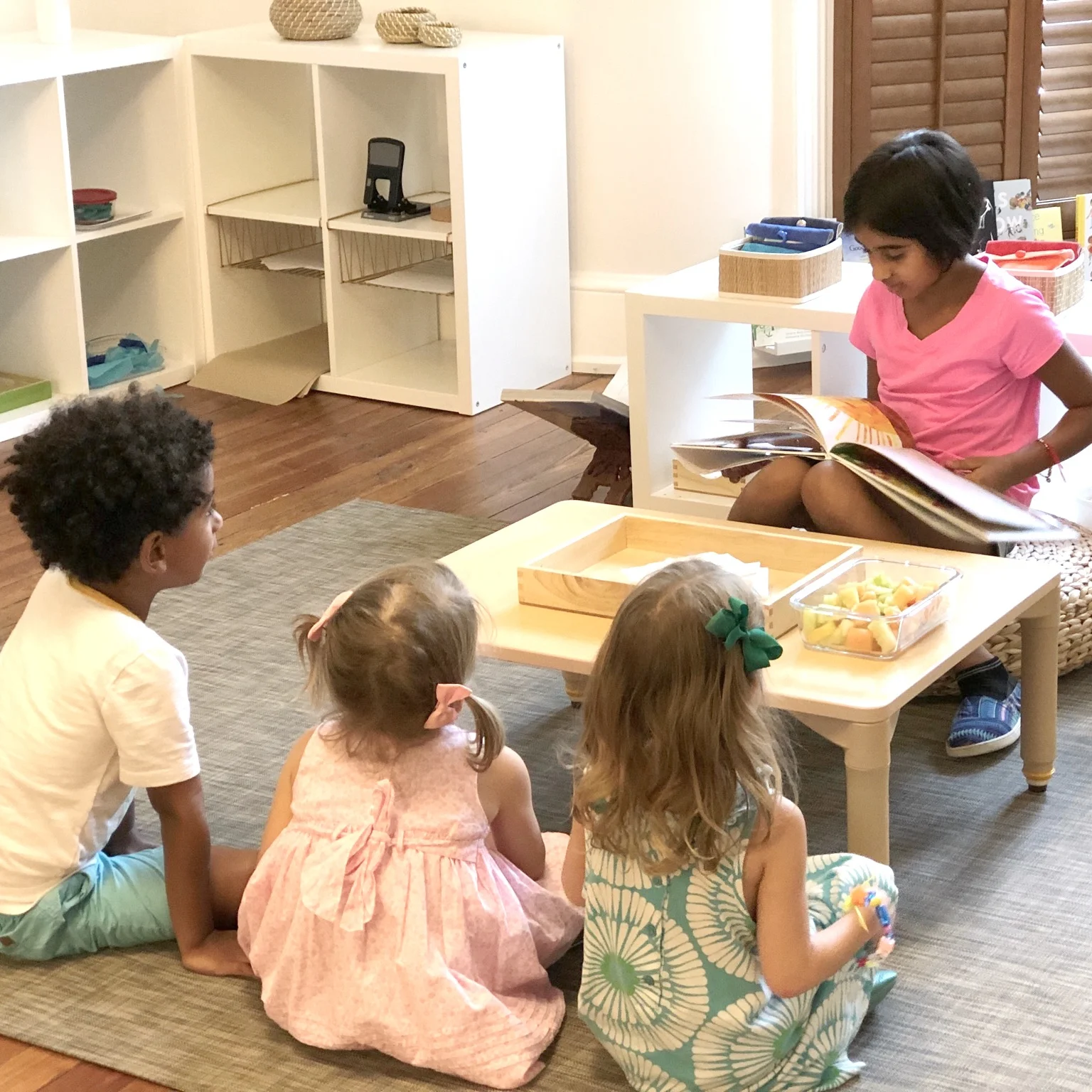 Neera reading to Luka, Evie, Madeleine.jpg