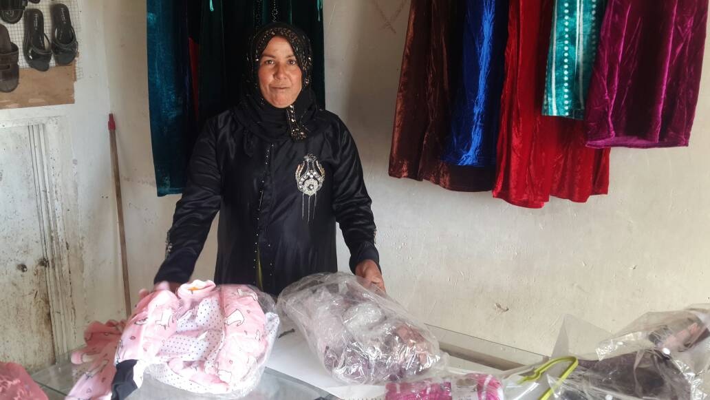 Sabeha unpacks her first stock for her store, October 2017. Photo by Bilal Anbar.