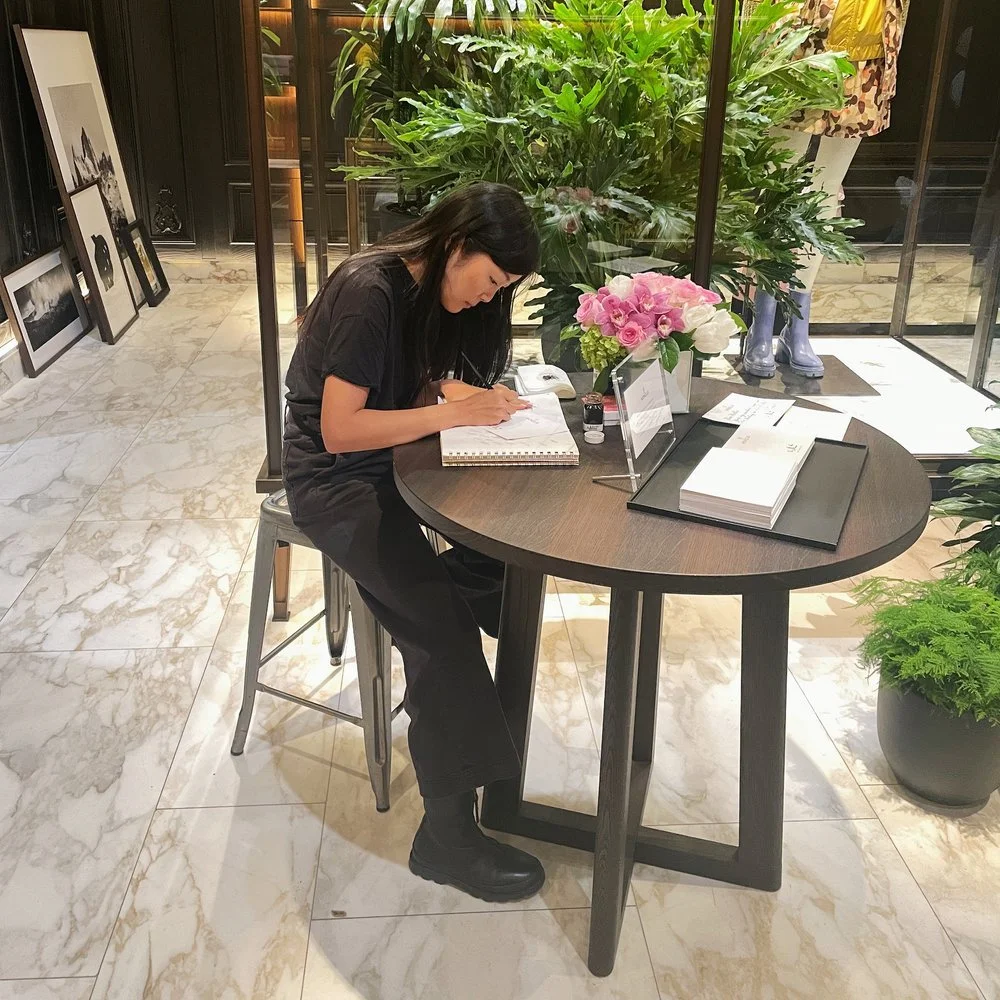 Live calligraphy personalization artist at luxury retail event in New York City