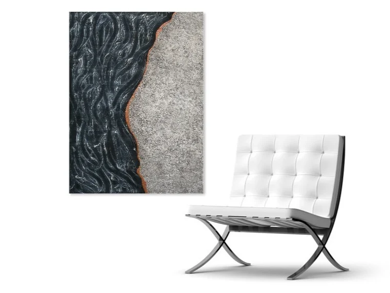 Shown hanging vertically beside a chair.