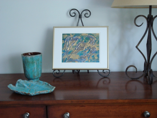 On a table easel on a dresser.