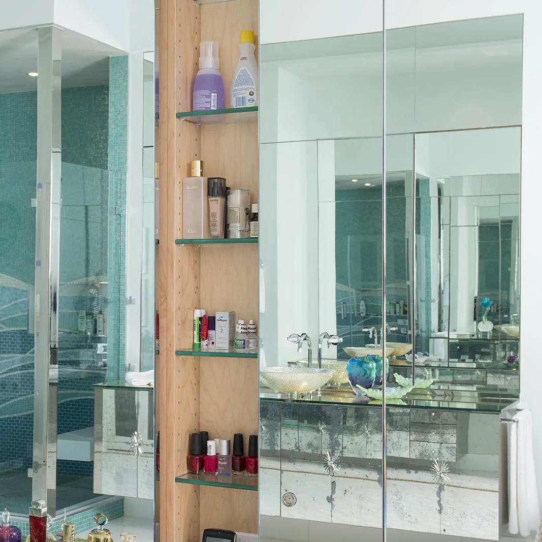 Detailed shot of medicine cabinet and sliding glass doors