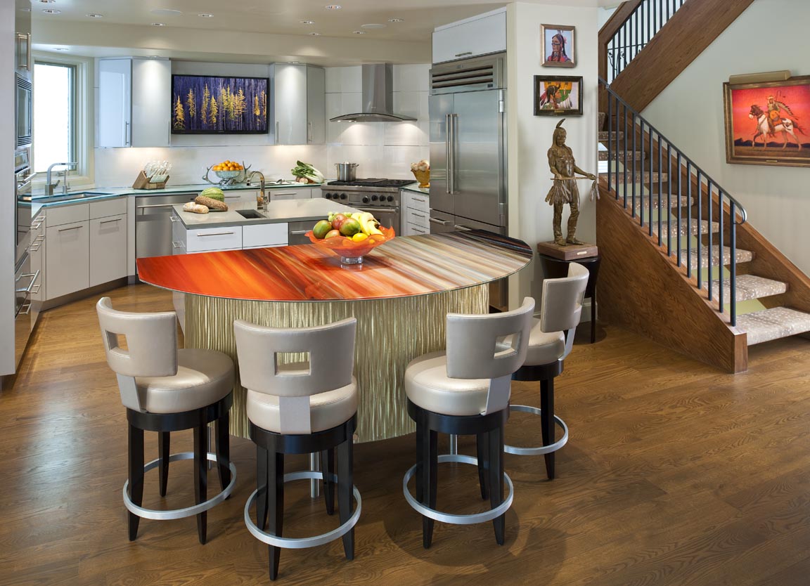 Art photography applied to this kitchen island is highlighted by under counter lighting. The face of the island is covered in custom 3 form material, back-lit with LED lighting for dramatic effect.