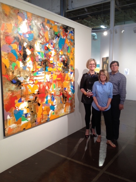 Mary Anne with Mary and Alberto Tomas next to Santana's piece Perception of Reality