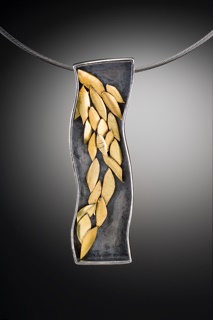 This piece started out with a flat, rectangular frame with unforgiving lines. By turning the frame on its edge and making it wavy, it not only worked to my strengths, it made for a much more interesting and unique piece of jewelry.