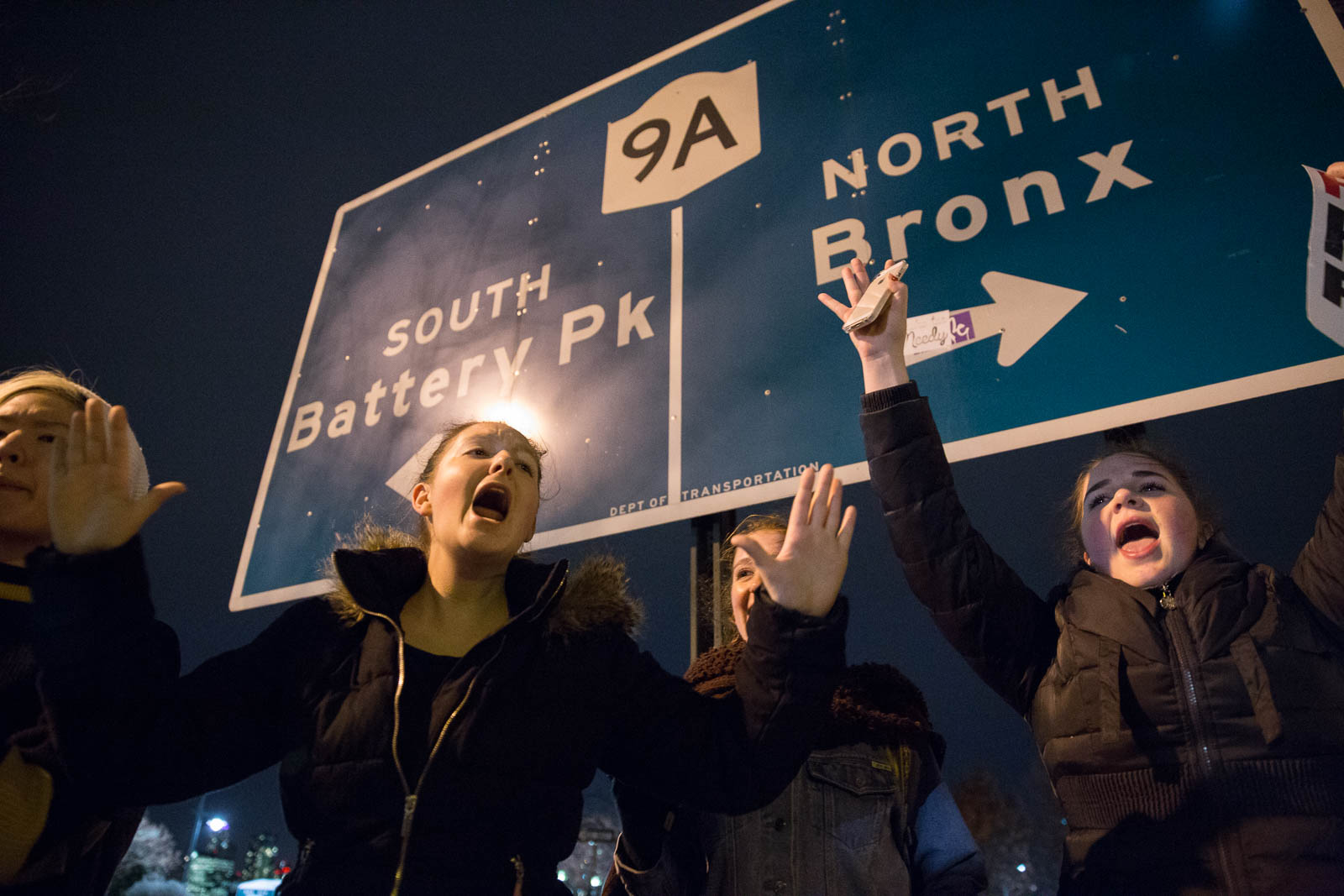 Student protestors gather on the West Side Highway, yelling "Hands up, don't shoot." 