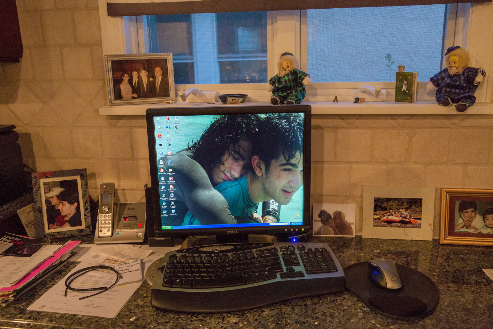 An image of Ashley prior to her transition (left) and her brother (right) is still the desktop image on the family computer.