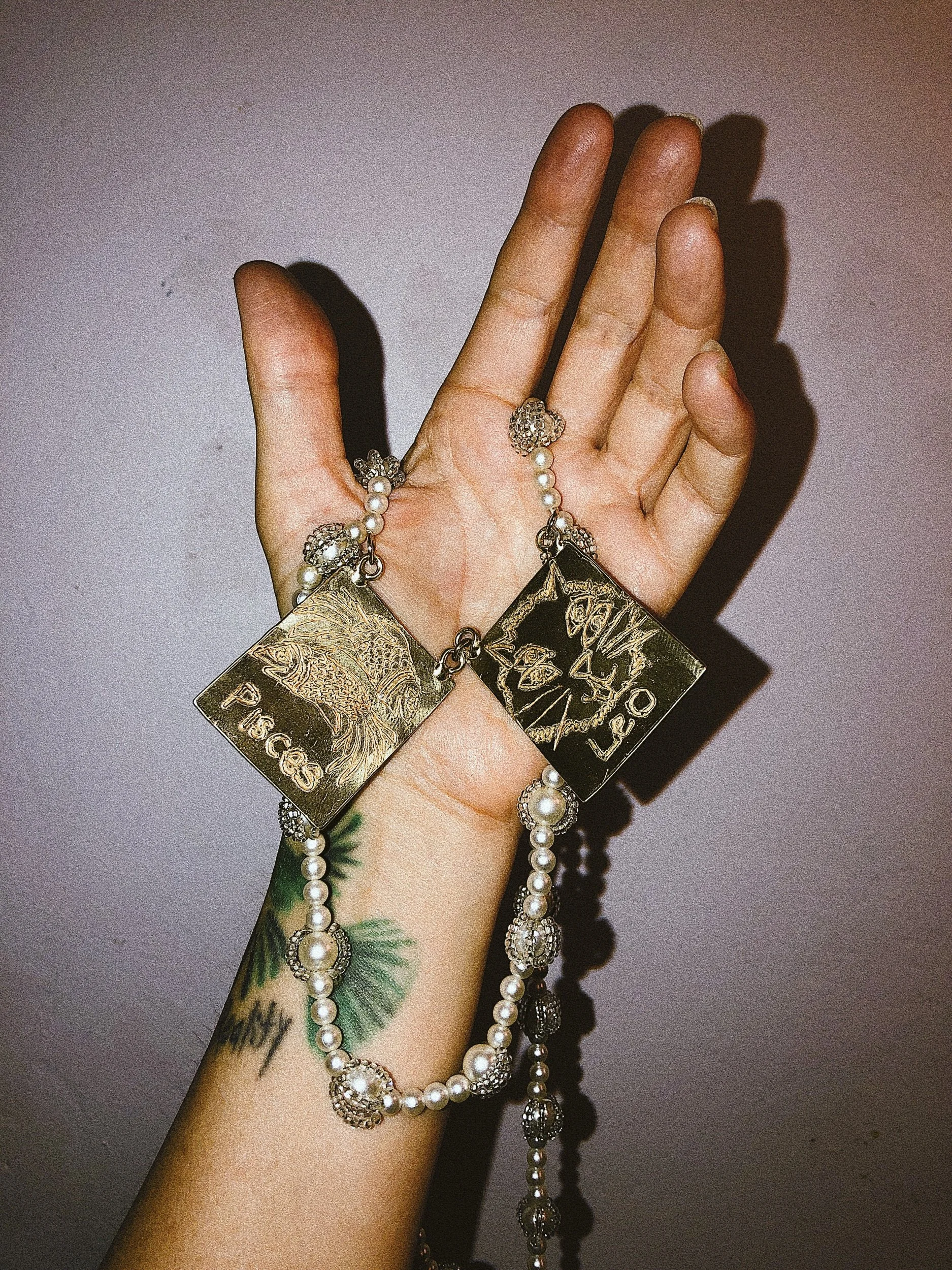 zodiac jewelry, astrology, Aquarius, leo, Pisces, pendant, art jewelry, statement necklace, hand drawn, jewelry designer, california