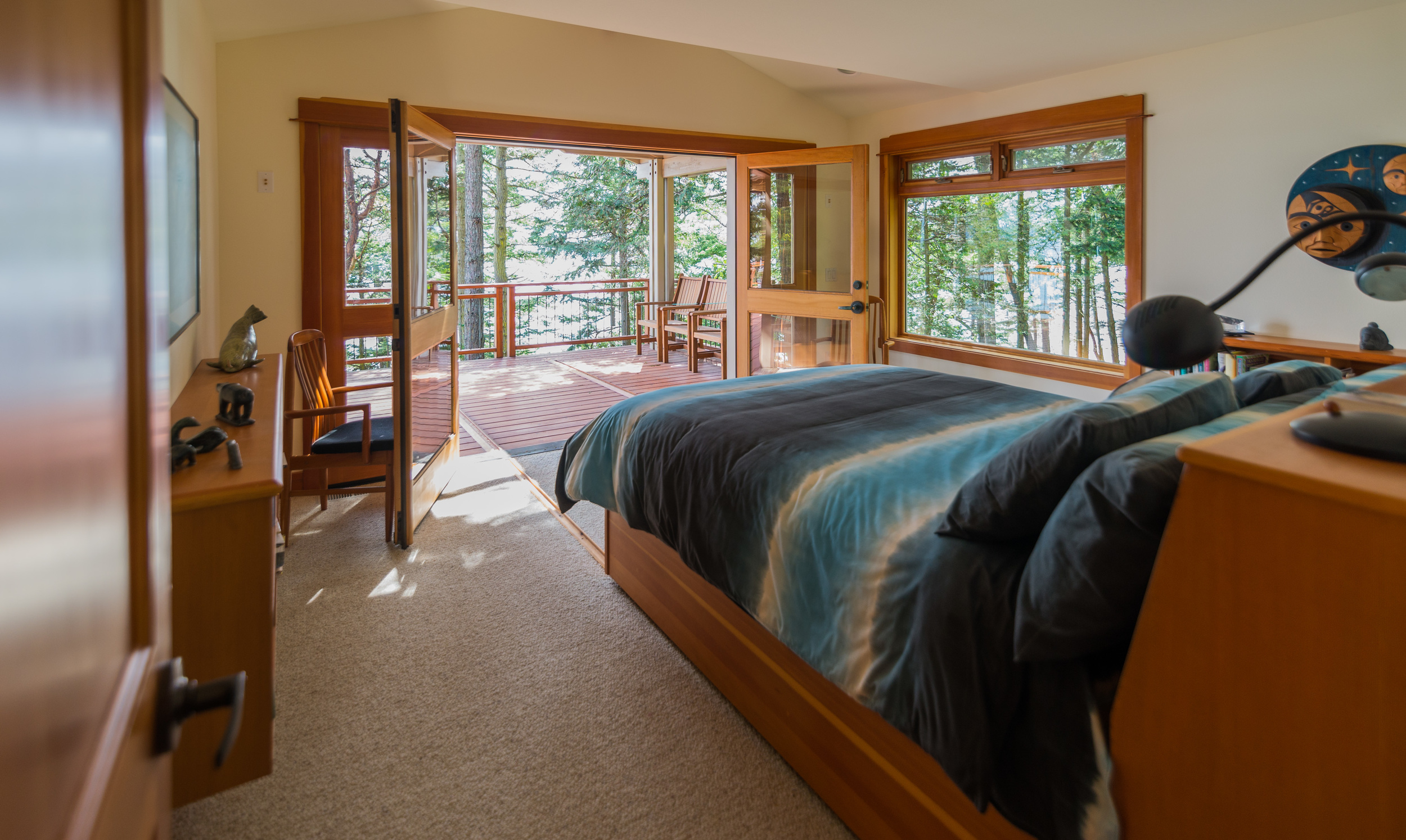 Clients requested us to build a custom bed that would roll out onto deck/sleeping porch. Bed in room........