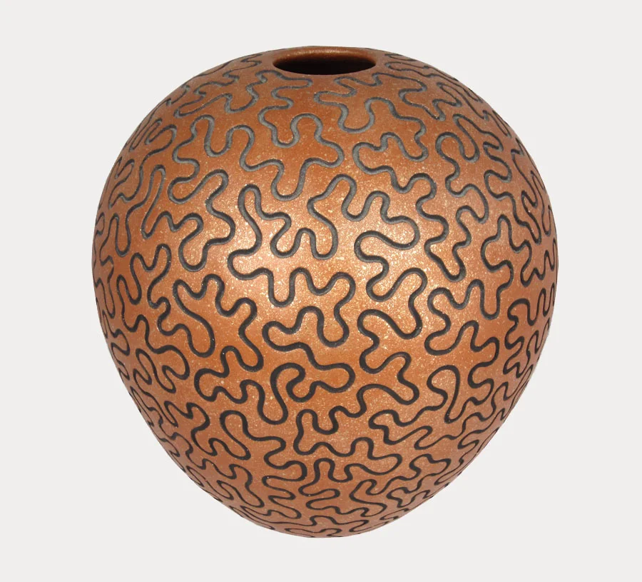 San Felipe puzzle pot by Herbert Candelario, 1995. https://www.marcyburns.com/pottery-collection/san-felipeo-pueblo-pot-by-herbert-candelario