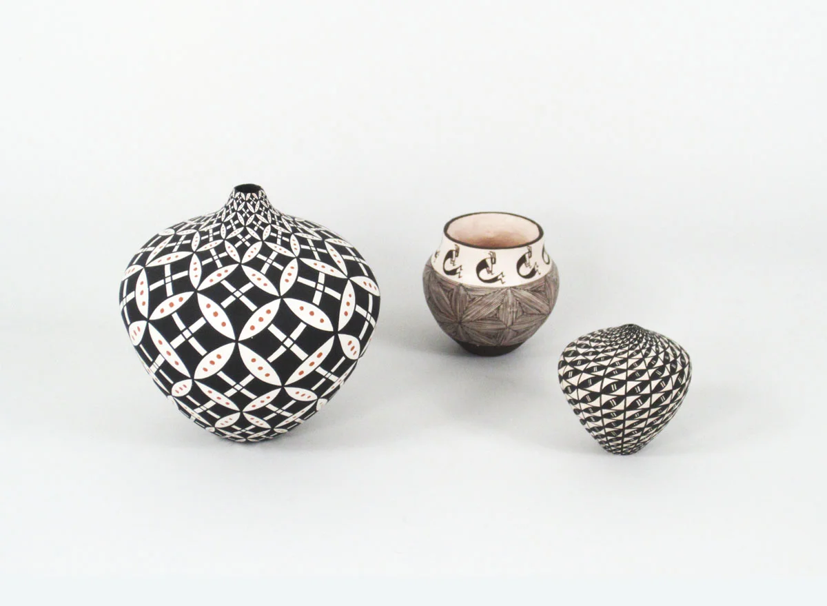 miniatures by: (left to right): Dorothy Torivio, Deborah Aragon, and Sandra Victorinoeach is described individually: http://www.marcyburns.com/pottery-collection/acoma-small-jar-with-geometric-op-art-design ; http://www.marcyburns.com/pottery-collection/acoma-miniature-seed-jar-by-1 ; http://www.marcyburns.com/pottery-collection/acoma-miniature-seed-jar-by