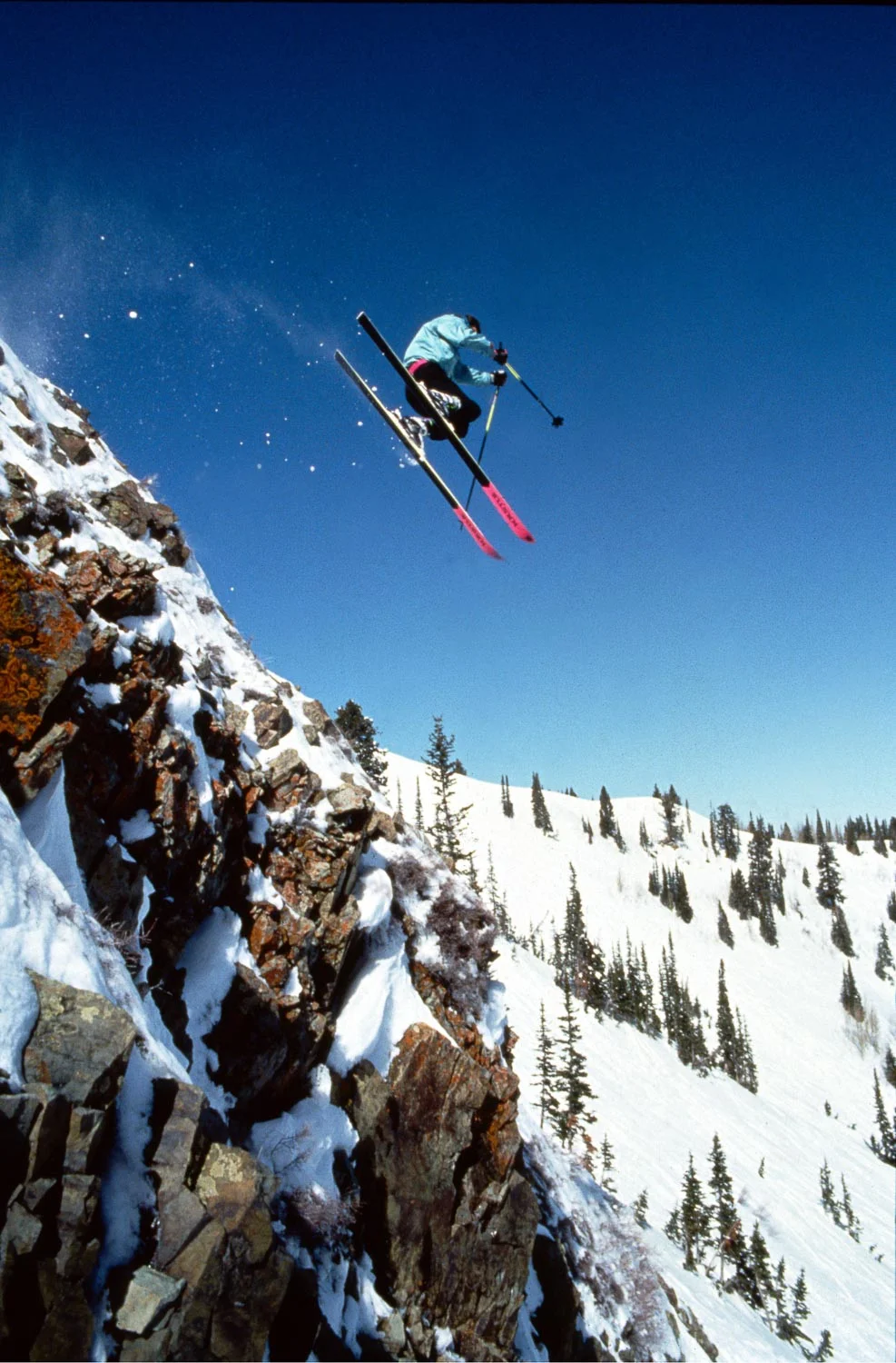Tom McDonald flies off a cliff band below Jupiter Peak, Park City Mountain. 1990. Photo © Mark Maziarz