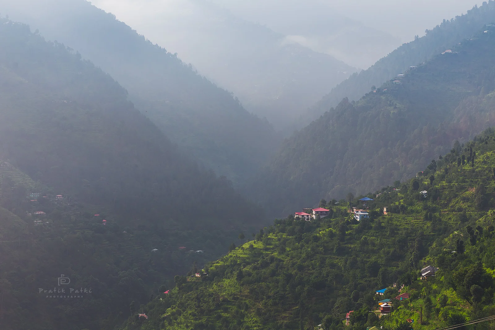Layers n layers of hills, some shrouded in mist some bathing in sunlight, a few villages strewn on the slopes and a winding road passing through them. A haven for cyclists!