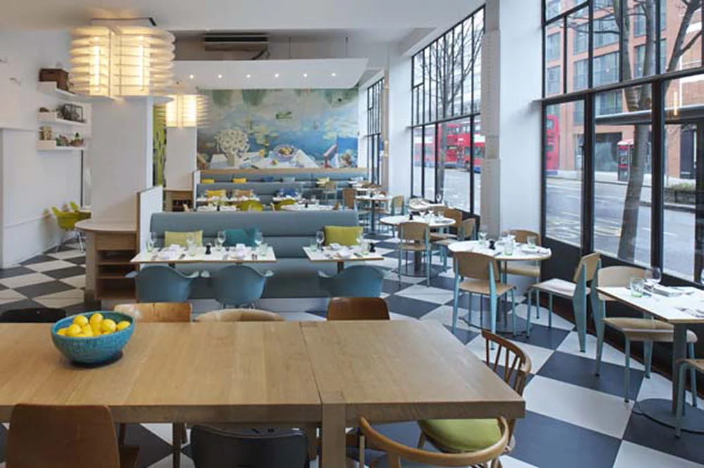 In collaboration with Creative Director Polly Dickens, Fowler & Co created this airy, modern interior for D&D London's Kensington Place restaurant featuring comfortable upholstered benches and solid joinery.