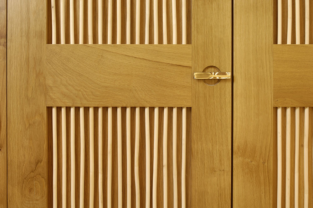 The pretty rattan dowells on these wardrobe doors give a subtle nod to traditional Chinese interior design.