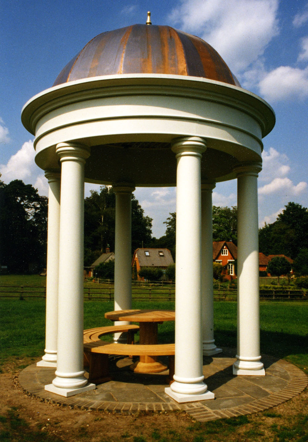 Constructed entirely from hardwood, this folly temple for a house in Windsor Great Park is crowned with a striking copper-clad dome.