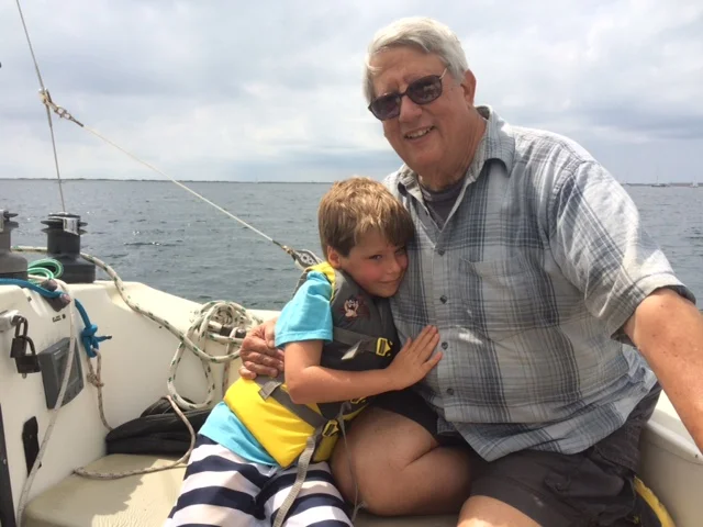 multigenerational vacation grandfather grandson boat