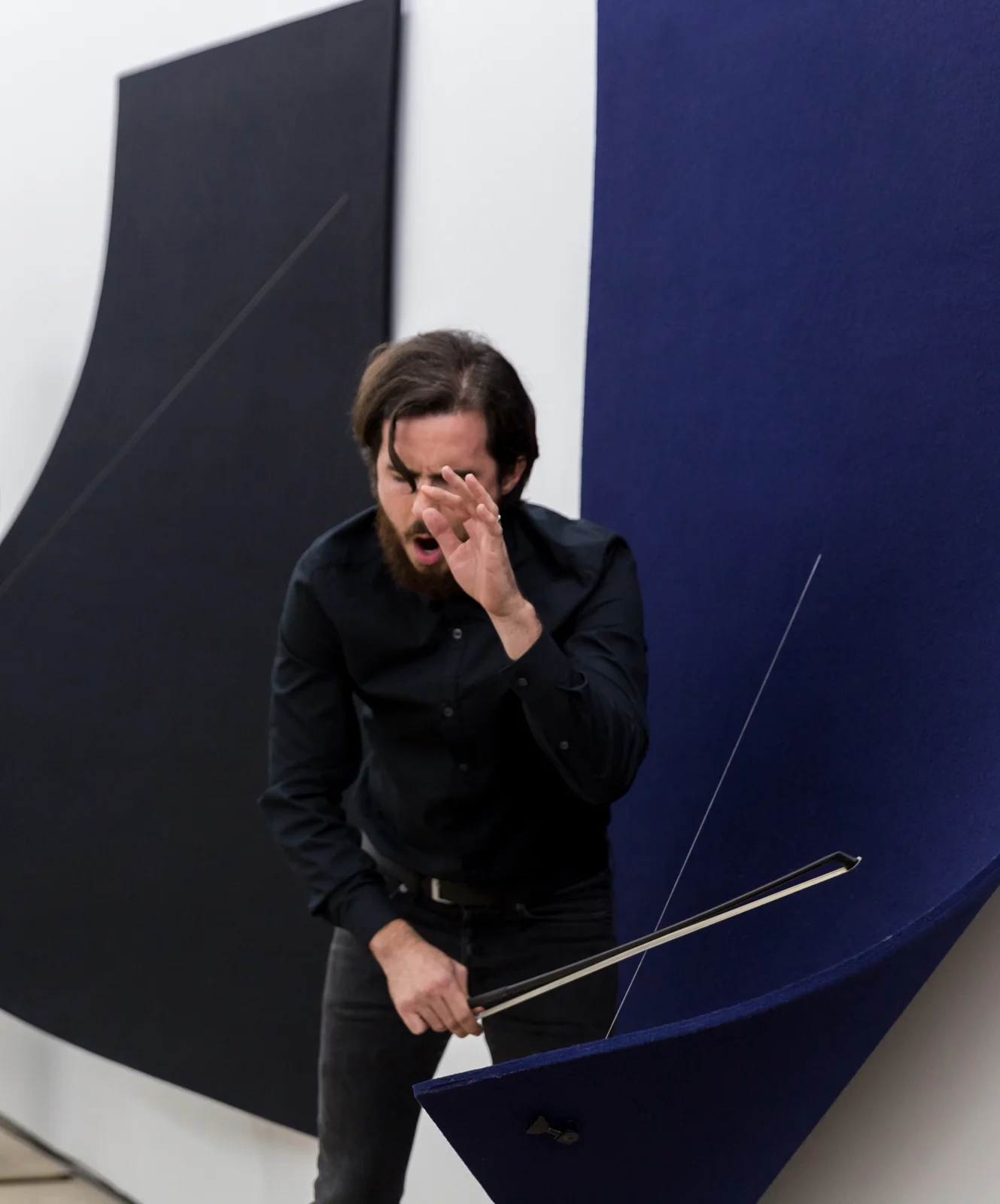 Performance on Work On Felt (Variation 9 and 10) Black and Midnight Blue (Diptych) , 2016 | Spinello Projects, December 2016. Photo: Diana Larrea.
