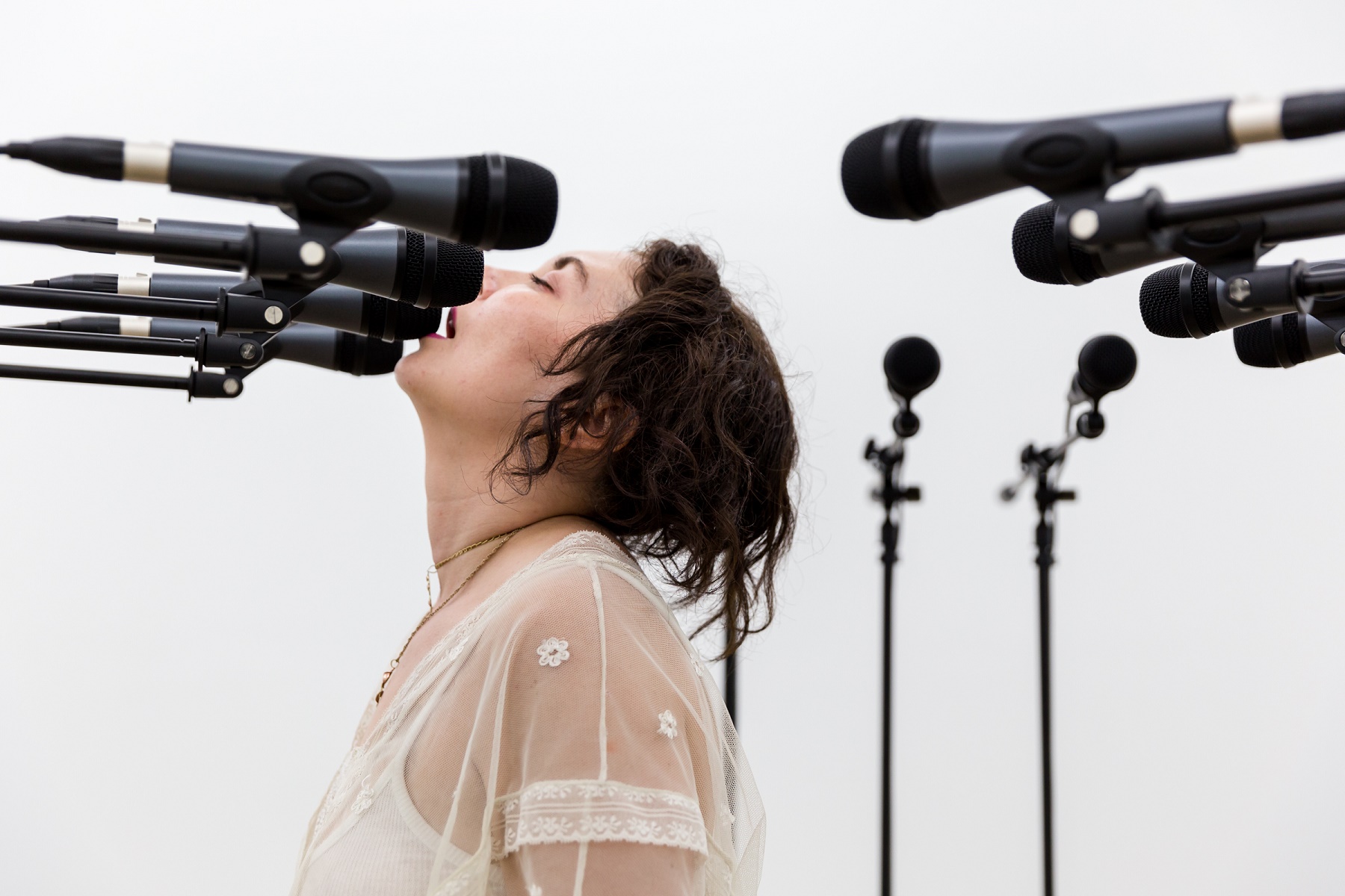 Barricade #3 , 2016, 12 microphones and microphone stands and matching audio equipment, 62 × 98 × 98 in. Photo: Diana Larrea.